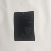 Sac en plastique d'emballage refermable avec propre logo imprimé à l'avant, dos transparent, fermeture à glissière laminée noire en PE, bouton de rechange