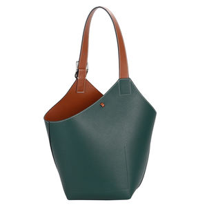 Sac seau élégant en cuir bicolore bleu sarcelle et beige avec bandoulière réglable - Product Image 1