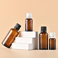 Bouteilles en verre rondes de type Boston, ambre, avec étiquette personnalisée en gros, de 5 ml à 100 ml, pour huiles essentielles et parfums
