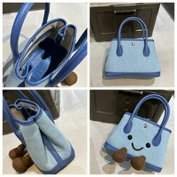 Approvisionnement direct usine Nouveauté Hiver 2026 Sac en peluche motif visage souriant, design unique et original, sac bandoulière en forme de poupée, sac à main pour le quotidien, sac en peluche