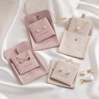 Fabricant Vente en gros Microfibre Carré 8*8cm Snap Bag Bijoux Anneau de stockage Collier Petits accessoires Stockage Logo en relief