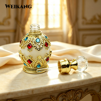 Nouveau produit : Flacon de parfum arabe 10 ml, exquis, avec filigrane doré et bijoux, et applicateur en verre.