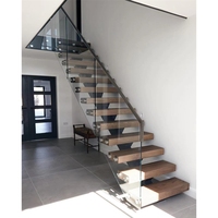 Escalier flottant préfabriqué sur mesure à poutre simple en acier thermolaqué avec marches en bois massif
