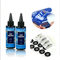 Colle souple UV à durcissement rapide, résine UV transparente cristalline à faible rétrécissement pour autocollants 3D en dôme