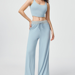 Matching set featuring a sports vest and loose-fitting, straight-leg <b>trousers</b> with an adjustable <b>drawstring</b>. - Product Image 1