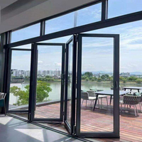 Porte pliante ZS à cadre fin, panneaux de verre minimalistes, quincaillerie dissimulée, glissière fluide, entrée de bâtiment commercial