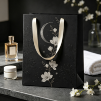 Sacs en papier personnalisés haut de gamme pour produits de beauté avec poignées en ruban, fabrication artisanale de qualité supérieure et sacs de shopping laminés brillants