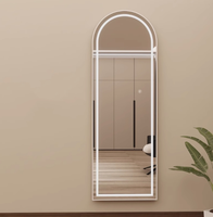 Miroir moderne à interrupteur tactile intelligent Miroir mural arqué avec lumière LED Cadre en métal brossé Matériau en verre