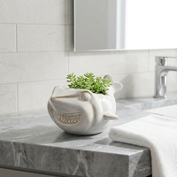 Grand pot en céramique en forme de coquillage avec texture spirale, glaçure réactive marron et bleue, décoration côtière, vente en gros