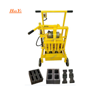 Petite machine manuelle de fabrication de briques en blocs de ciment en béton à vendre en Ouganda pour la ponte des œufs 2-45