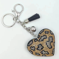 Koningsblauwe modieuze sleutelhanger met luipaardprint, hartvormig, volledig bezet met strass steentjes en kwastjes, best verkochte charme hangende ornament