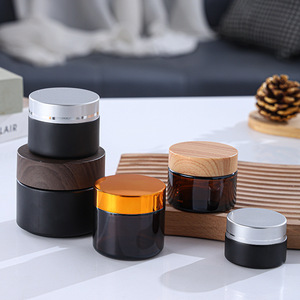 Vente en gros de pots cosmétiques vides en verre avec couvercles noirs pour l'emballage de gommage au beurre corporel Tailles de 5g à 100g pour les soins de la peau et la crème pour les yeux - Product Image 4