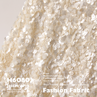 Tissu mat à paillettes haut de gamme avec une texture écailleuse pour la mode, les robes de mariée, les vêtements et les foulards.