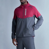 Survêtement 100% polyester coupe-vent imperméable avec empiècements en maille respirante extensible dans les quatre sens et poches réfléchissantes