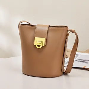 Guangzhou factory stock girls stylish messenger purses cow leather sling bucket bag brown trendy crossbody bags for women 2022