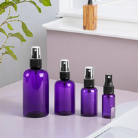 Bouteille ronde en PET violette avec pulvérisateurs à fine brume noirs pour l'emballage de shampooing, de parfum, de lotion, de crème et d'eau
