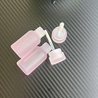 Tube d'emballage de conteneur transparent rose de forme spéciale pour le soin des lèvres Tubes de brillant à lèvres en plastique vides de brillant à lèvres