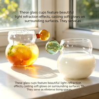 Bouteille en verre monocouche de luxe de haute qualité avec design minimaliste, poignée sphérique en forme de gourde, surface transparente estampillée or