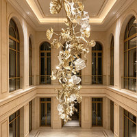 Lustre moderne artistique en forme de longue branche de feuille avec cristaux de luxe et design LED pour hall d'hôtel, villa et projets résidentiels