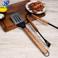 Ensemble de 2 pinces-spatules de barbecue antiadhésives à revêtement noir, résistantes à la chaleur et de qualité alimentaire, avec poignée en bois rivetée, pour barbecue domestique