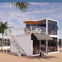 Maison conteneur préfabriquée modulaire en acier de 20 pieds avec mur rideau en verre pour bureau, studio, jardin, extérieur