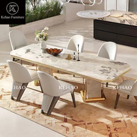Ensemble de table à manger rectangulaire en marbre de luxe avec base en marbre à bordure dorée, chaises rembourrées, style moderne pour villa