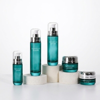 Bouteilles et pots en verre cylindriques transparents à bouchon arrondi avec couleurs de logo personnalisées pour emballages de soins de la peau, contenants en vrac de 30g, 50g, 40ml, 100ml, 120ml