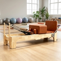 Reformer de Pilates portable et réglable en bois d'érable ou de chêne, durable, avec sangles de sécurité et poulies pour studio de Pilates