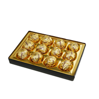 Confiseries au chocolat aux miettes de biscuits, chocolats en boules dorées en gros de l'usine de chocolat, en boîte