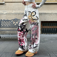 Pantalon large blanc vieilli à imprimé abstrait dessiné à la main, style American High Street, avec motif graffiti urbain et coupe couteau, pour hommes et femmes