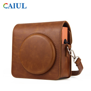 Sac <span class=keywords><strong>photo</strong></span> Caiul pour <span class=keywords><strong>Instax</strong></span> <span class=keywords><strong>Square</strong></span> SQ1, marron rétro, en cuir PU, étanche, 12,8x7x14cm, bandoulière réglable - Product Image 1