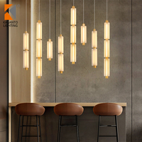 Lustre moderne de petite taille Rakumba Metropol Sebastian Herkner, suspension en verre et fer avec pendentifs en verre