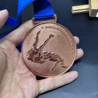 Medalla de diseño 3D de esmalte suave de forma redonda chapada en latón fundido a presión personalizada de fábrica, medalla de bronce deportiva de lucha de alta calidad