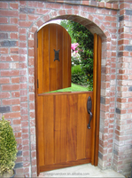 Porte double en bois massif de style traditionnel pour villa, porte d'entrée en bois ovale finie avec des motifs ronds