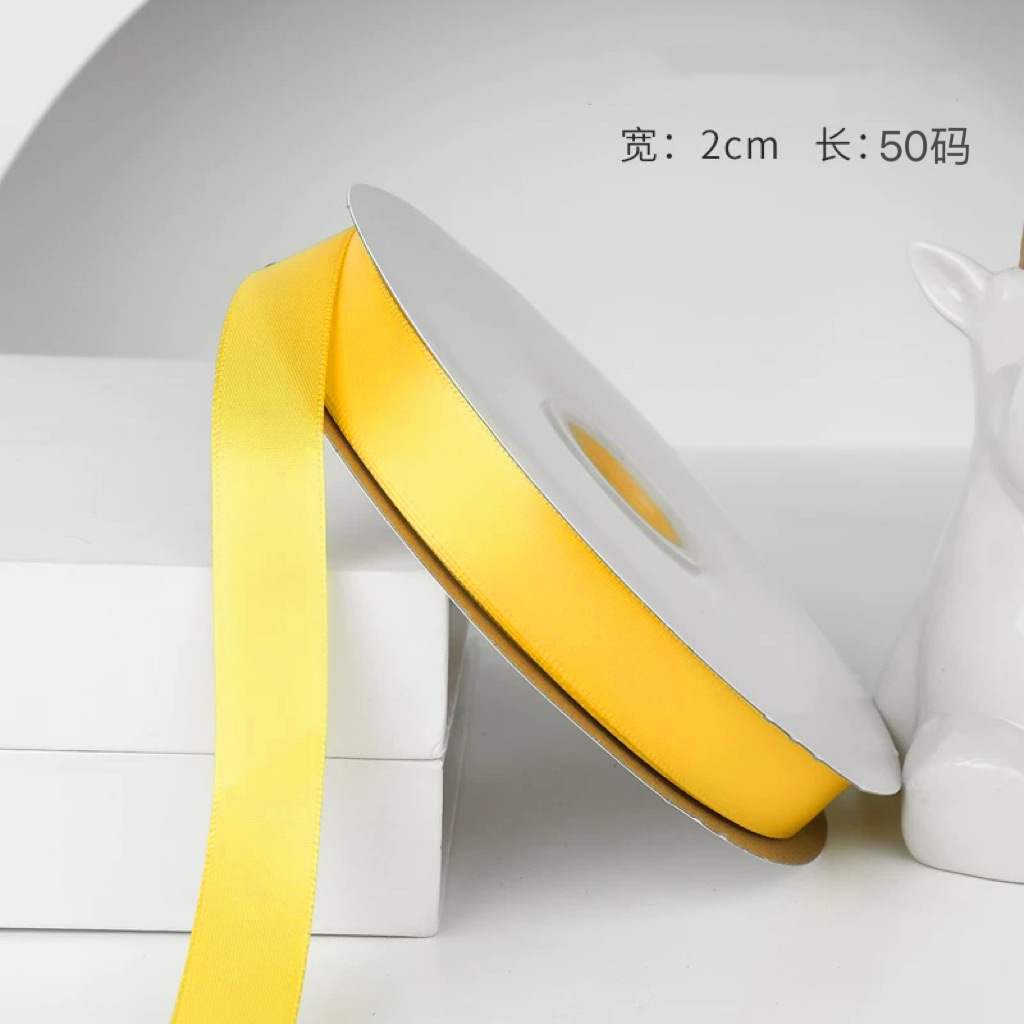 #ริบบิ้นโพลีเอสเตอร์สีเหลืองทอง 650 ขนาด 2 ซม. ยาว 50 หลา