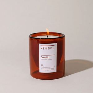 Bougie en cire de coco biologique Mescents Castillo dans un bocal en verre ambré, parfum de cyprès et de sel fumé - Product Image 1