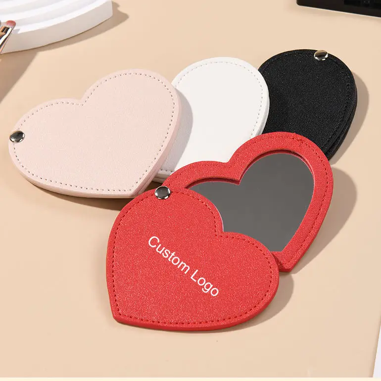 SAIYII doux en forme de coeur en cuir Pu miroir de poche quantité minimale de commande basse Logo personnalisé rotatif Pu miroir de maquillage compact pour les femmes