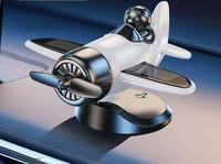 Ornements rotatifs de support de voiture en plastique créatif à énergie solaire pour les décorations de console centrale de voiture en gros