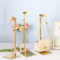 Tienda especializada en expositores de bolsos de pie, soportes ajustables para exhibición de bolsos, y expositores de bolsos de acero inoxidable para centros comerciales.