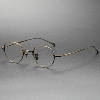 Lunettes optiques en titane pur, montures de lunettes de vue ovales unisexes tendance, vente en gros de lunettes pour hommes et femmes