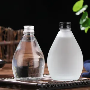 Customized glass bottle water droplet shaped coffee bottle 100ml 280ml 350ml 500ml beverage juice milk beverage glass bottle