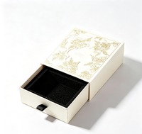 Boîte cadeau de luxe avec tiroir, dorure à chaud, motif floral en relief, papier texturé, emballage pour bijoux, fermeture magnétique, matériaux recyclés, mousse noire