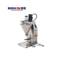 Remplisseuse de poudre semi-automatique DINGCHI en acier inoxydable pour lait, café, protéines en poudre, sacs en verre, boîtes de conserve, 1-25 boîtes/min