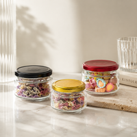 Pot en verre rond transparent personnalisé de 100 ml, 180 ml, 220 ml, 280 ml, 500 ml avec couvercle en métal pour le stockage des aliments, des bonbons, des épices et l'emballage cosmétique