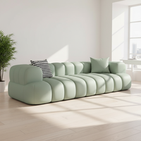 Canapé d'angle style crème inspiré de la texture des nuages noirs Marshmallow pour petit appartement, hôtel, villa, avec revêtement en tissu