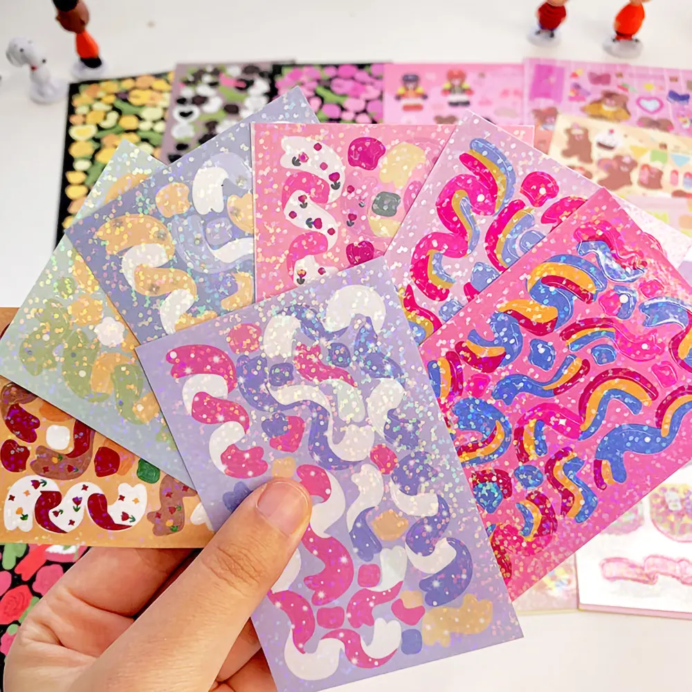 Manufacturer Custom Adhesive A4 A5 A6 Transparent Vinyl Kawaii Korean Kiss Cut Rainbow Effect Glitter Sticker Sheets Printing