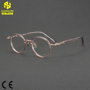 81087 OEM&ODM Montatura Occhiali Rotonda Minimalista Vintage John <span class=keywords><strong>Lennon</strong></span>, Telaio Ibrido in Acetato e Titanio, Occhiali Retrò Unisex con Aste Verdi - Product Image 1