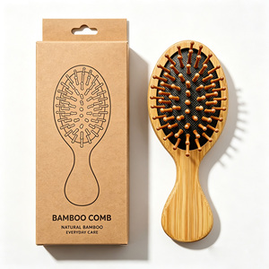 Mini peigne à cheveux ovale en bambou naturel avec picots en bois pour enfants et cuirs chevelus sensibles - Product Image 1