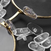 Le fabricant soutient la petite vente en gros de plaquettes de nez en PVC pour lunettes, accessoires de chaîne de lunettes, plaquettes de nez verrouillables en plastique pour lunettes