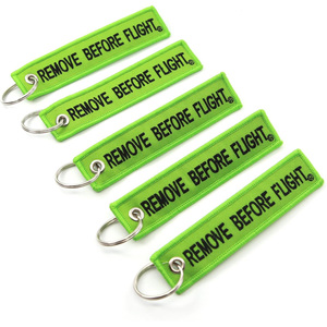 Venta al por mayor barato personalizado marca mover vuelo coche logotipo tela clave etiqueta bordado llavero - Product Image 3